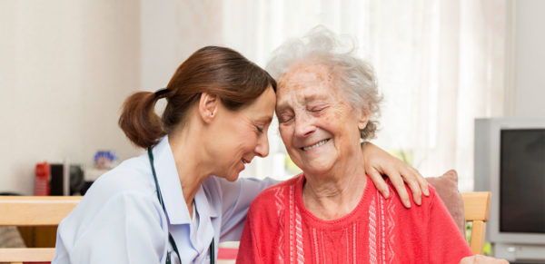 nurse and patient smiling